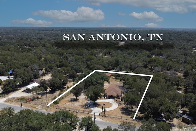 drone / aerial view with a view of trees