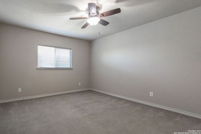 unfurnished room featuring light carpet and ceiling fan