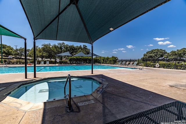 view of swimming pool with a patio area