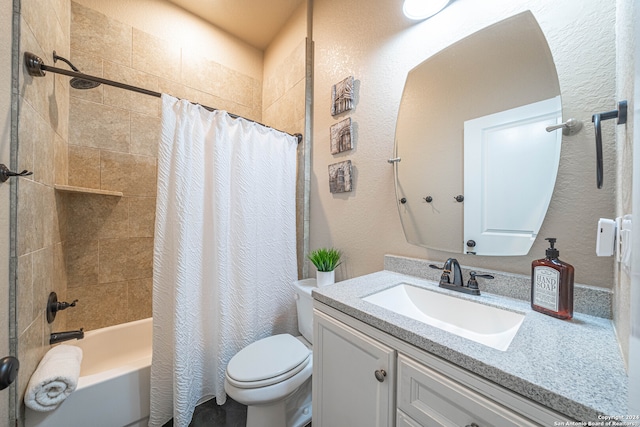 full bathroom featuring toilet, shower / bath combo with shower curtain, and vanity