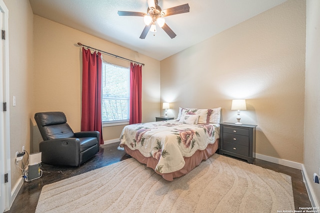 bedroom with ceiling fan and dark hardwood / wood-style floors