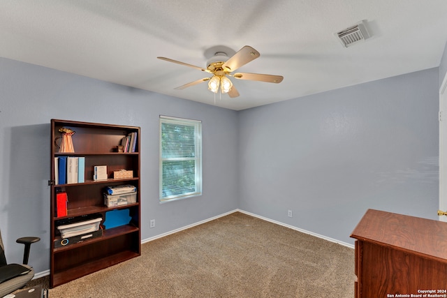 interior space featuring ceiling fan and carpet floors