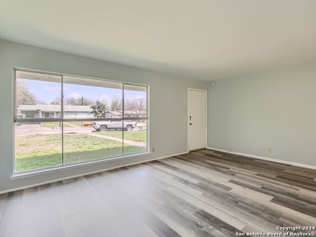 unfurnished room featuring wood-type flooring