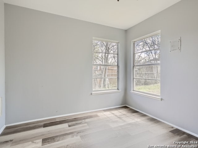 unfurnished room featuring wood-type flooring