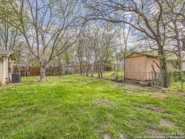 view of yard with central AC