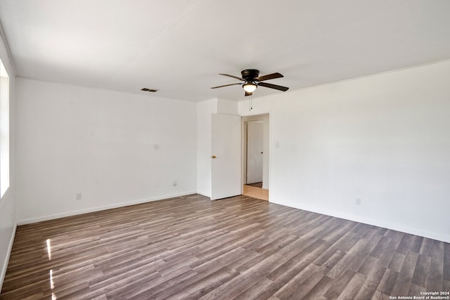 empty room with ceiling fan and hardwood / wood-style floors