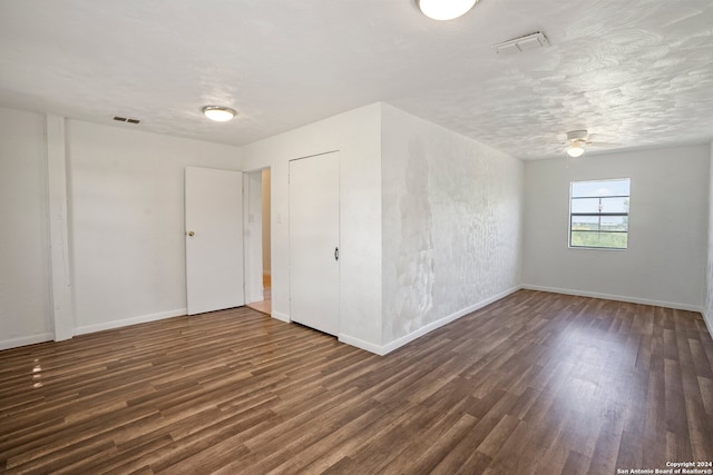 unfurnished room with ceiling fan and wood-type flooring