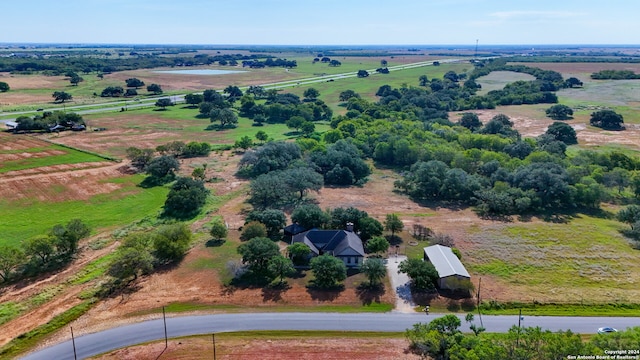 birds eye view of property with a rural view