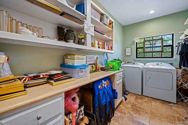 clothes washing area featuring washing machine and clothes dryer and light tile patterned flooring