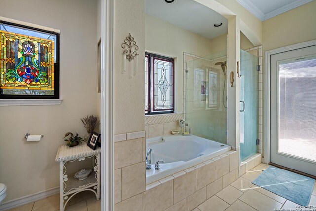 exercise area with ceiling fan, light tile patterned floors, and crown molding