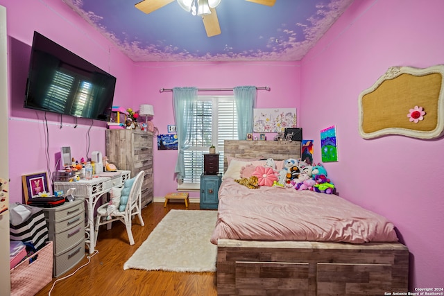 bedroom featuring ceiling fan and hardwood / wood-style flooring