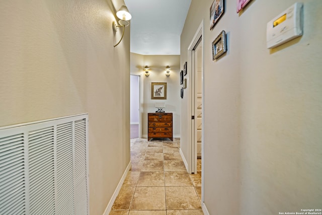 hallway featuring light tile patterned floors