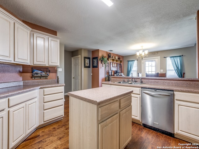 kitchen featuring a center island, dark hardwood / wood-style flooring, a chandelier, a textured ceiling, and dishwasher