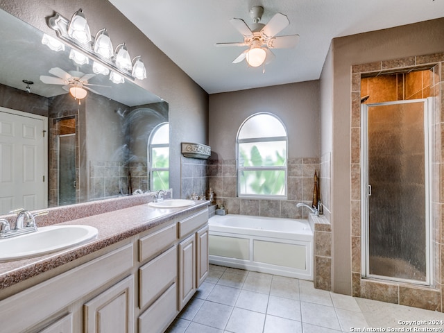 bathroom with ceiling fan, independent shower and bath, tile patterned flooring, and vanity