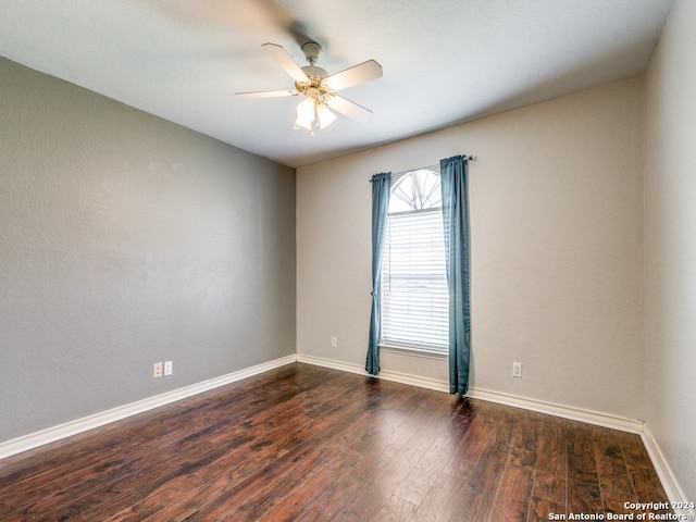 empty room featuring ceiling fan and hardwood / wood-style flooring