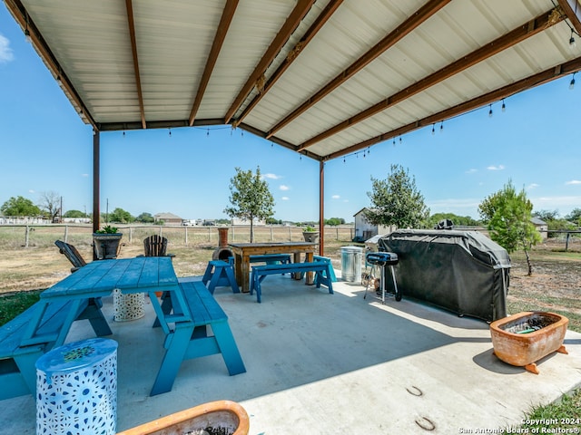 view of patio / terrace with grilling area and a fire pit