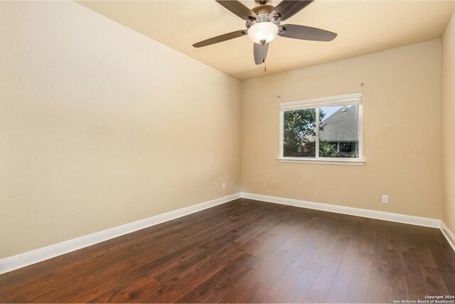 spare room featuring ceiling fan and hardwood / wood-style flooring