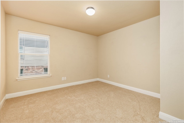 empty room featuring light colored carpet