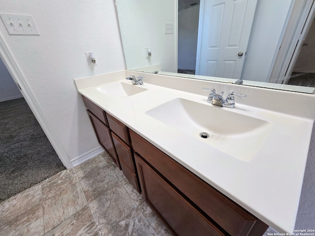 bathroom with tile patterned flooring and vanity