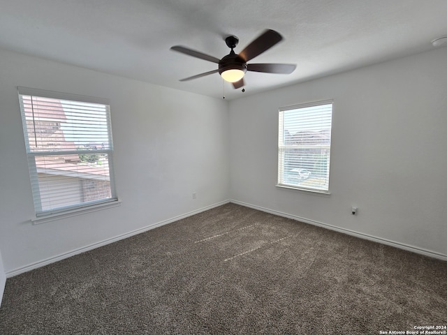 carpeted empty room with ceiling fan