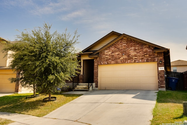 view of front of house featuring a garage and a front yard