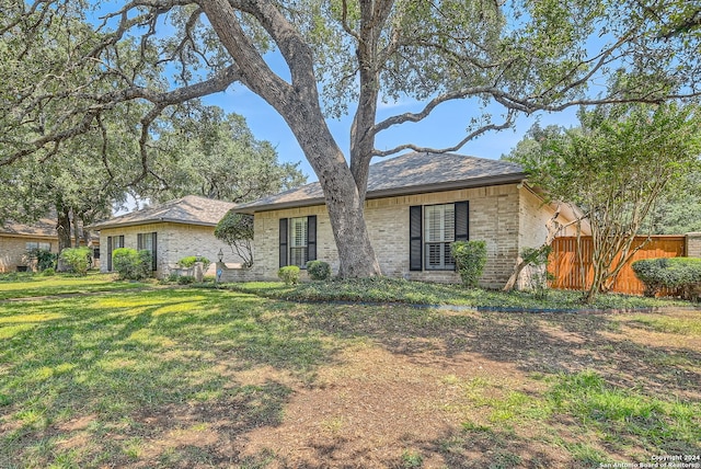 ranch-style house with a front yard