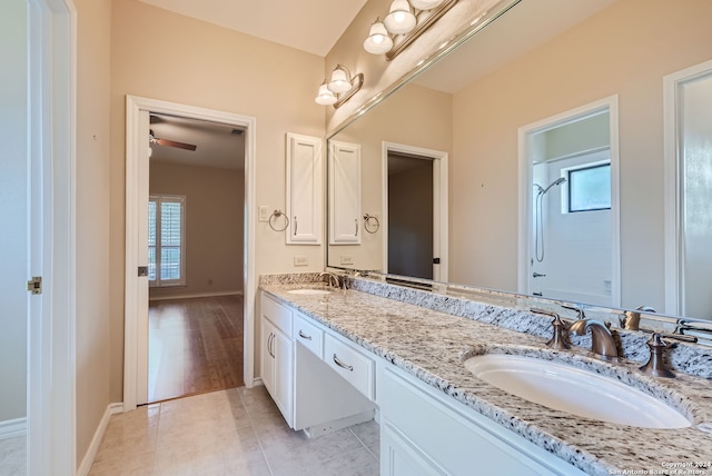 bathroom featuring ceiling fan, tile patterned flooring, vanity, and shower / tub combination