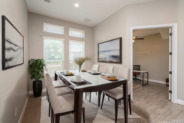 dining room with light wood-type flooring and ceiling fan