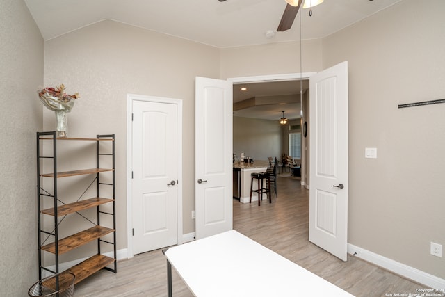 bedroom featuring lofted ceiling and light wood-type flooring