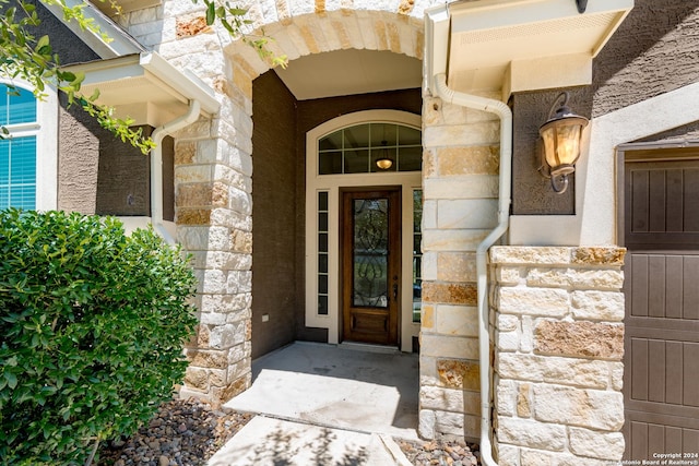 view of exterior entry with stone siding