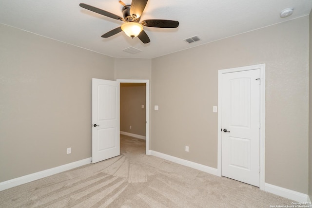 unfurnished bedroom featuring visible vents, ceiling fan, light carpet, and baseboards