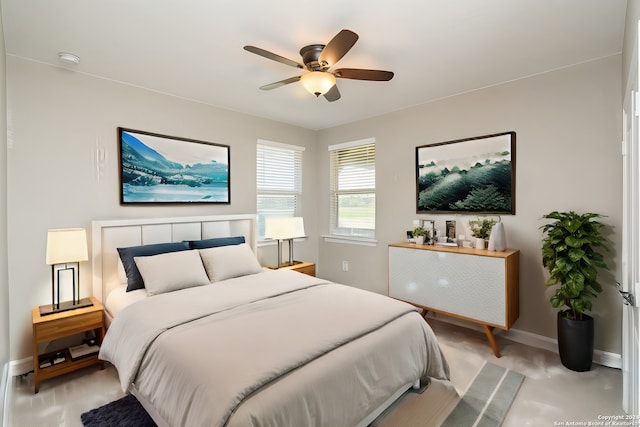 bedroom featuring ceiling fan and baseboards