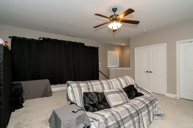 carpeted bedroom with ceiling fan