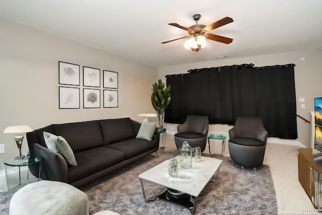 carpeted living room featuring ceiling fan