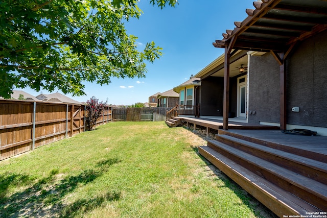 view of yard featuring a wooden deck