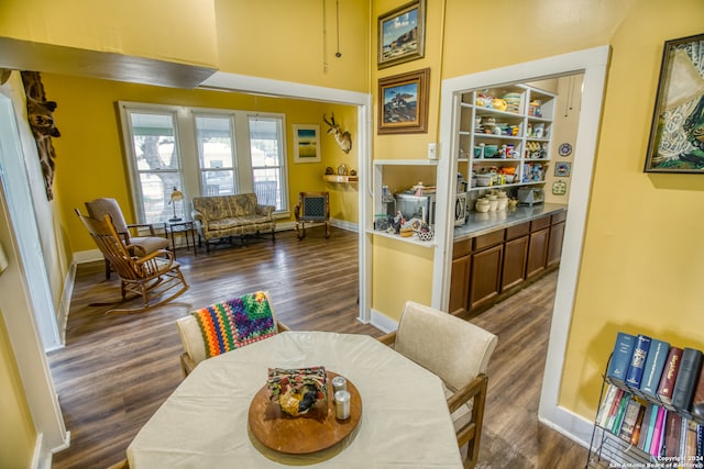 dining area featuring dark hardwood / wood-style floors