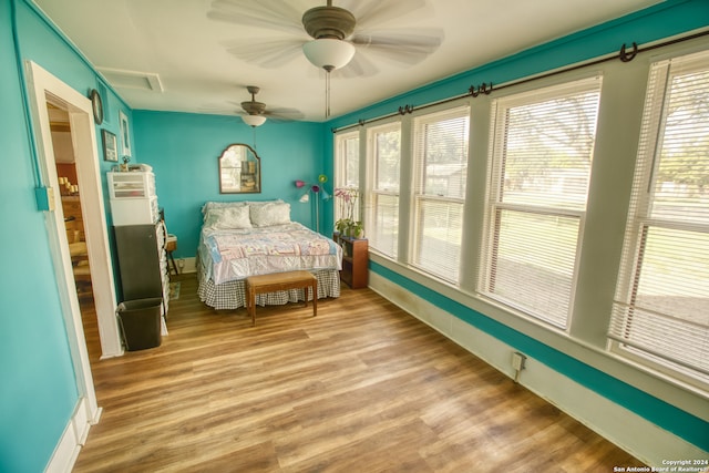 bedroom featuring ceiling fan and light wood-type flooring