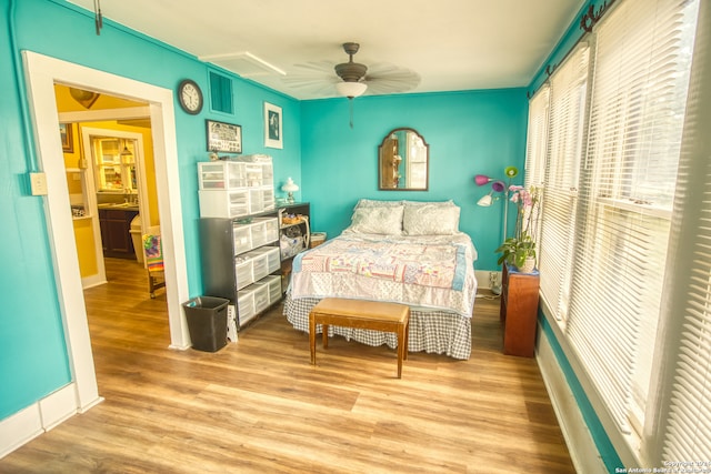 bedroom featuring hardwood / wood-style flooring and ceiling fan