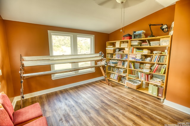 sitting room featuring hardwood / wood-style flooring and lofted ceiling