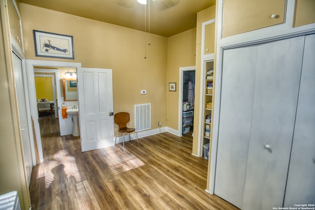 interior space featuring hardwood / wood-style floors and a towering ceiling