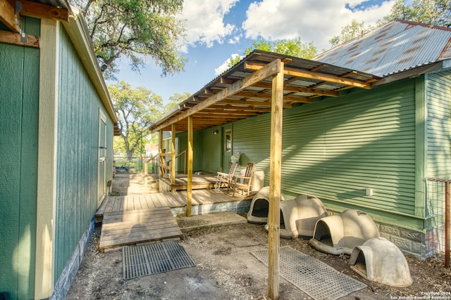 view of side of home with a deck