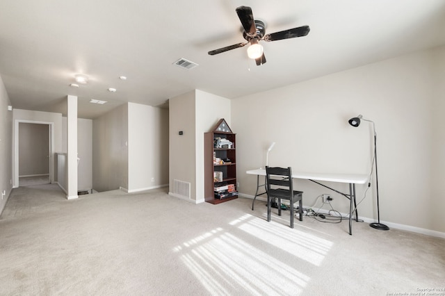 home office with ceiling fan and light colored carpet