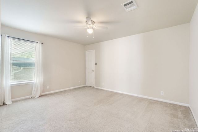 carpeted empty room with ceiling fan