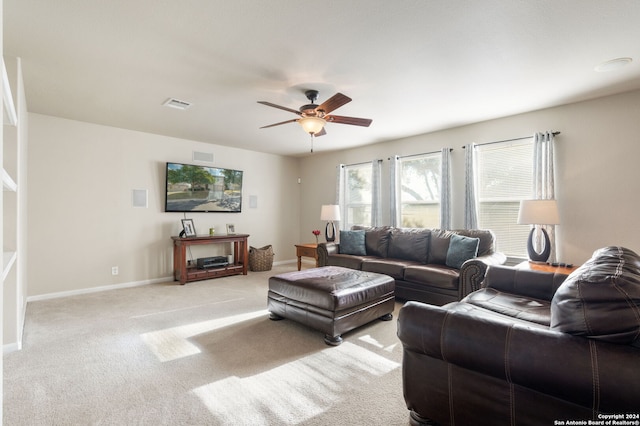 living room with ceiling fan and light carpet