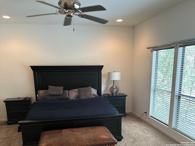 carpeted bedroom featuring ceiling fan