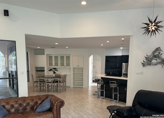 tiled living room with a high ceiling