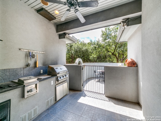 view of patio / terrace with grilling area, area for grilling, and ceiling fan