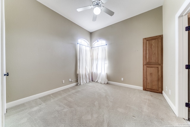 carpeted empty room with ceiling fan