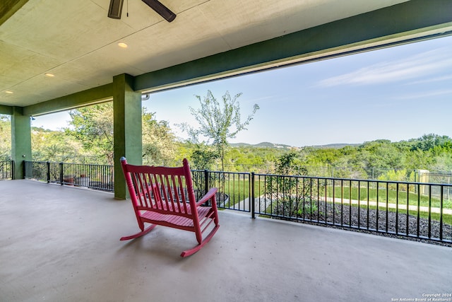 view of patio / terrace featuring ceiling fan and a balcony