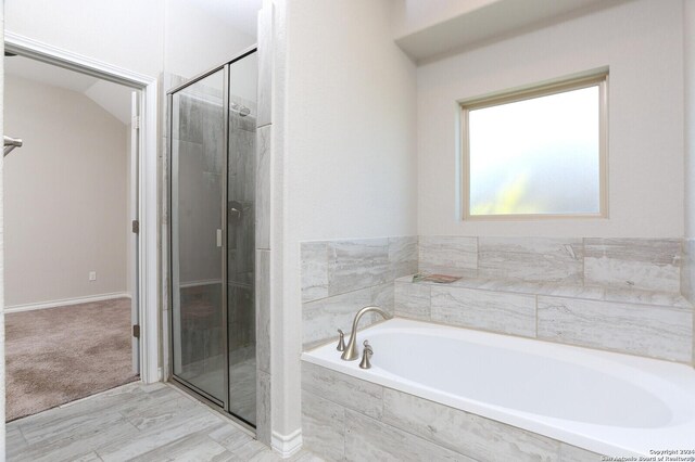 bathroom with independent shower and bath